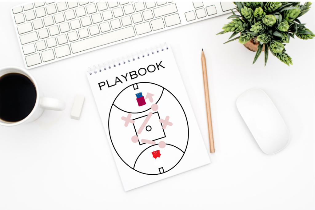 AFL football playbook on desk