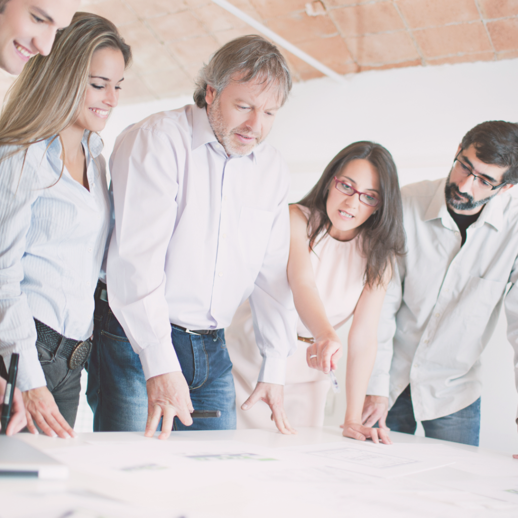 Employees looking over plans